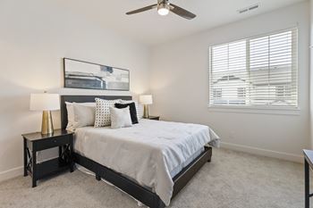 White bedroom with fan